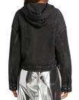A person is seen from the back wearing a black Rag & Bone miramar terry hood trckr jckt and shiny silver metallic pants, set against a plain white background.