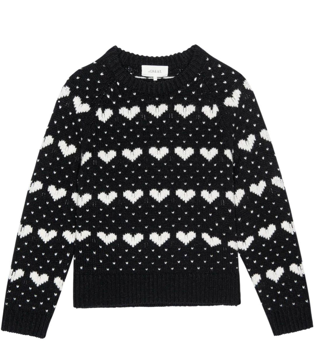 The Heart Crew sweater by The Great Inc. features a black design with white heart motifs and small dots evenly arranged across the front, sleeves, and neckline.