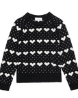The Heart Crew sweater by The Great Inc. features a black design with white heart motifs and small dots evenly arranged across the front, sleeves, and neckline.