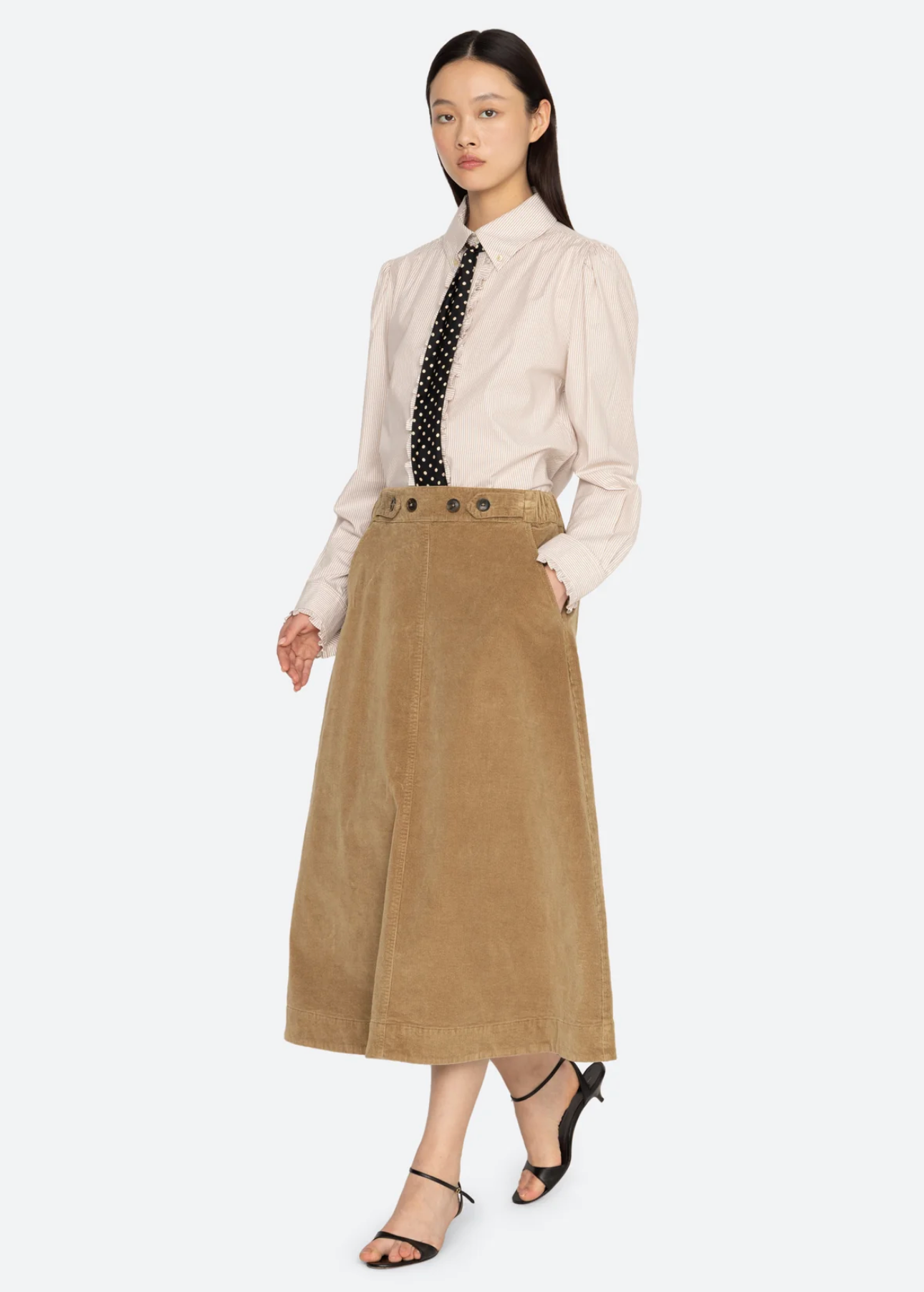 Garrett Corduroy Midi Skirt by Sea New York in black, styled with a striped shirt and polka dot tie.
