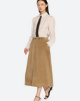 Garrett Corduroy Midi Skirt by Sea New York in black, styled with a striped shirt and polka dot tie.