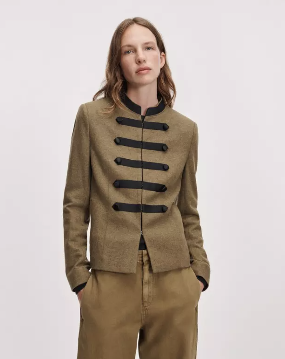 Mercer Regalia Blazer by Rag &amp; Bone in dark fabric, paired with tan pants, styled against a simple backdrop.