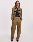 Khaki Rag & Bone Mercer Regalia blazer styled with black shirt, loose khaki pants, and pointed black shoes.