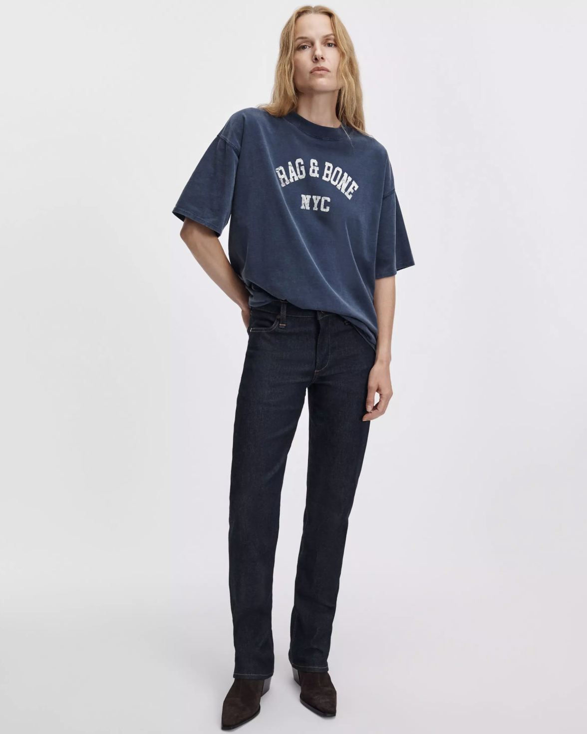 Rag &amp; Bone university alex tee in white, styled with dark jeans against a plain background.