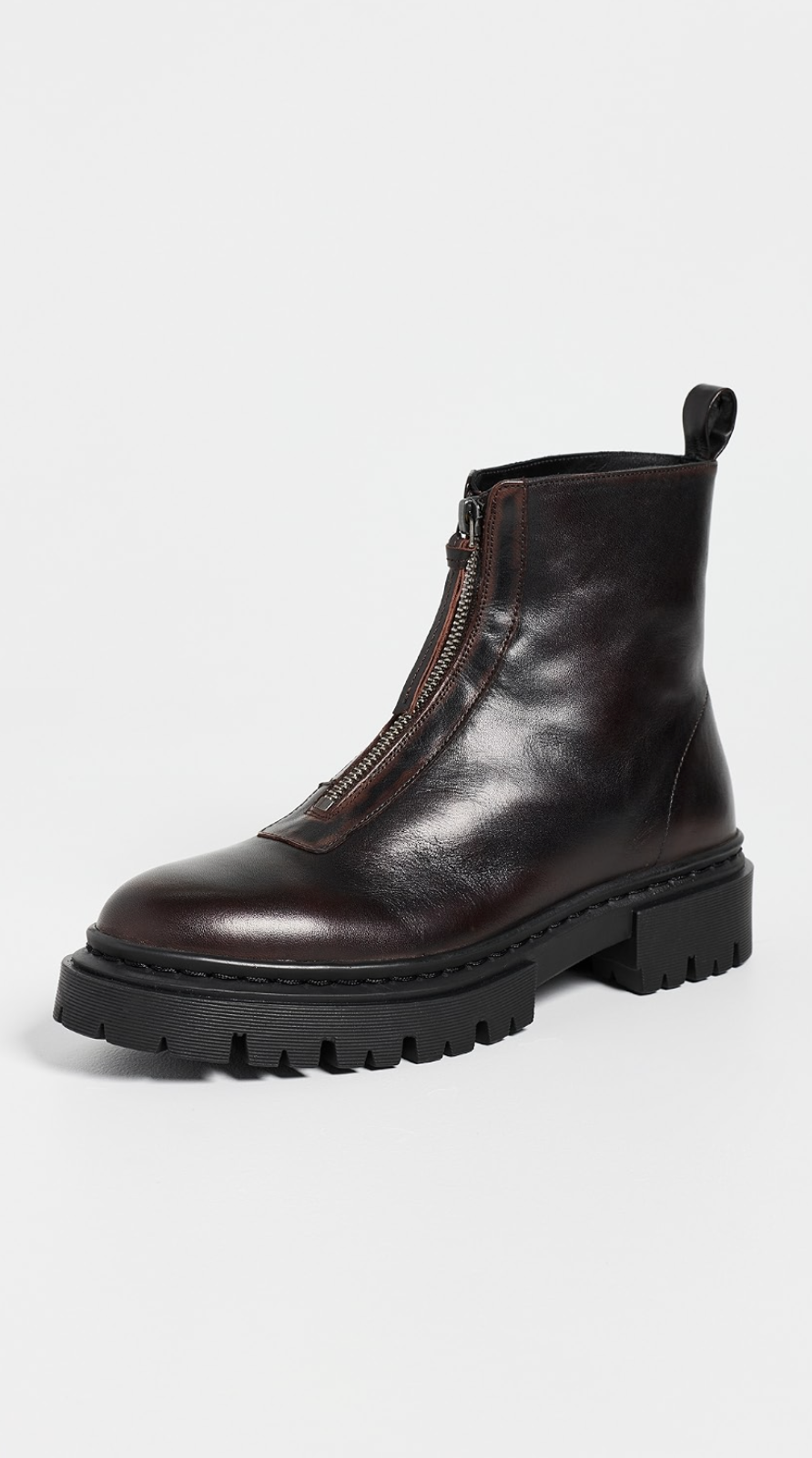 Staud Miles dark brown ankle boot with chunky black sole and front zipper on white background.