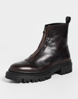 Staud Miles dark brown ankle boot with chunky black sole and front zipper on white background.