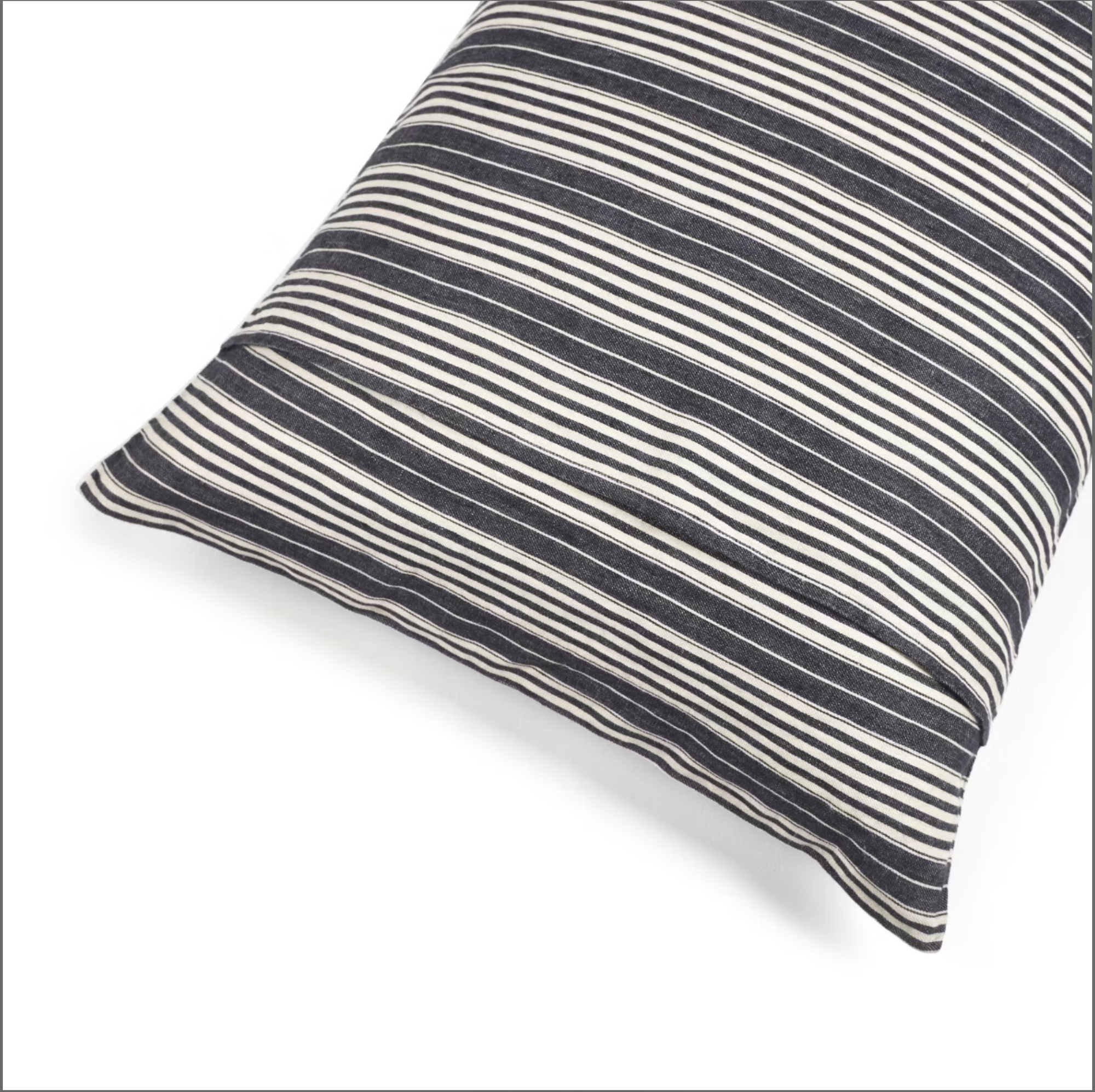 The Tack Stripe Pillow by Libeco Home features horizontal black and white stripes on Belgian Linen—a stylish rectangular accent to elevate your bedding ensemble.