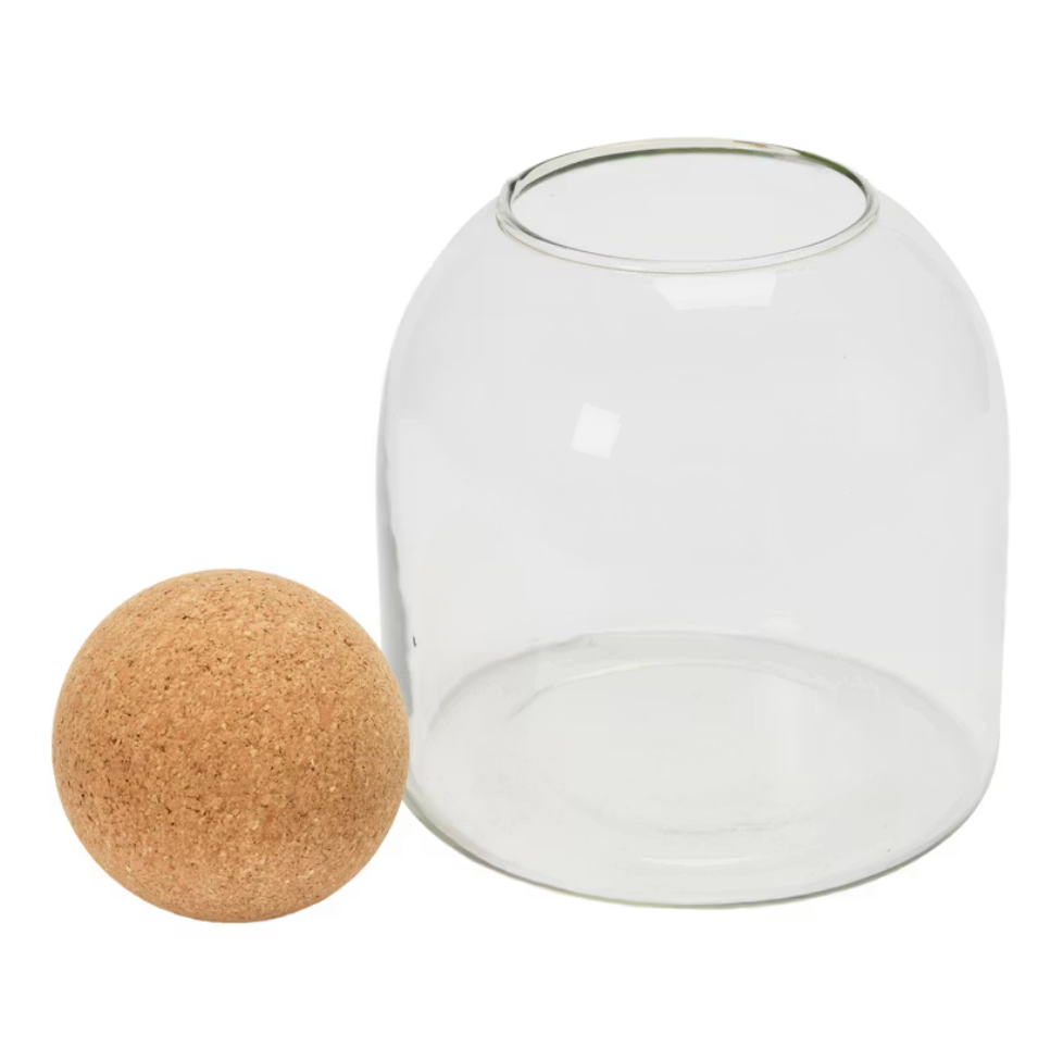 The Bloomingville Glass Jar Cork Ball features a round glass jar with an open top and a large spherical cork lid, ideal for decorative storage. This stylish set is displayed against a crisp white background.