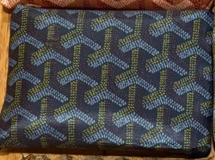 The Faire Reusable Shopping Bags Assorted feature a stylish geometric pattern in blue and green on a dark background, offering a designer-inspired touch while providing an eco-friendly solution for your shopping needs.