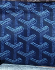 A close-up of Faire's Reusable Shopping Bag, designer-inspired in blue, showcases a repeating geometric pattern of interlocking Y-shaped designs in lighter blue shades.