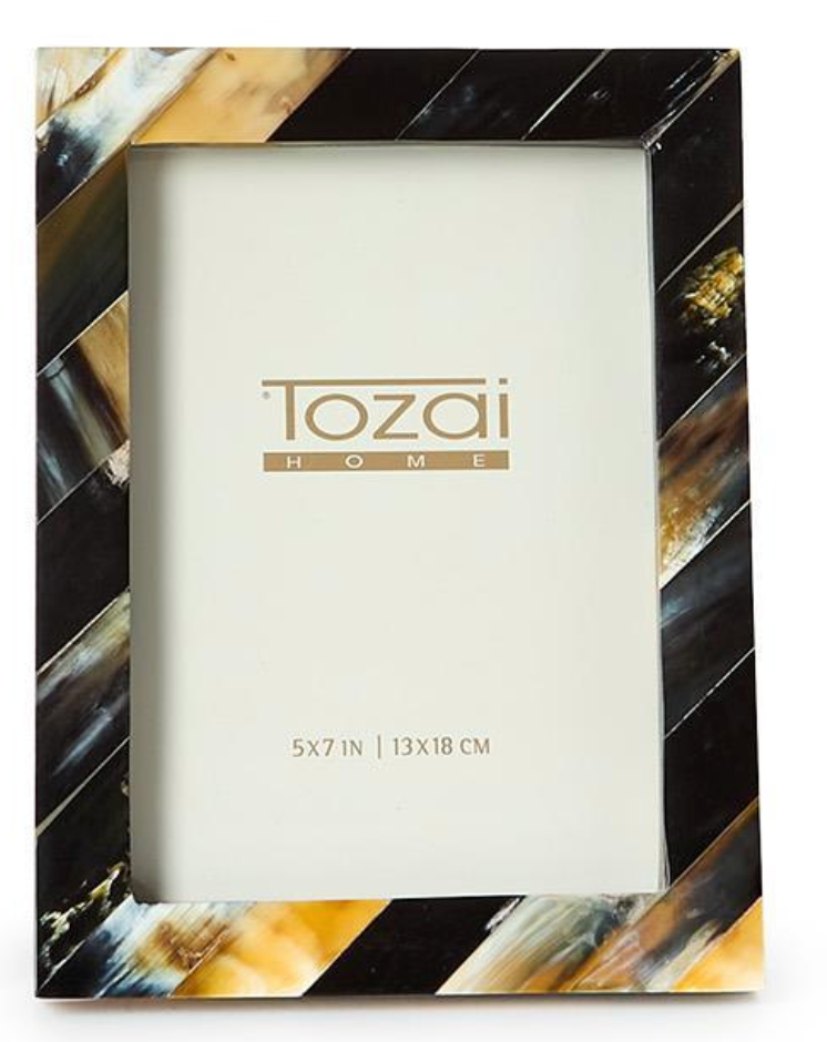 The Black Horn Photo Frame by Two's Company features a handcrafted rectangular design with a glossy diagonal striped pattern in black, white, brown, and beige. Holds a 5x7 in photo—ideal for anyone seeking a touch of luxury for their pictures.