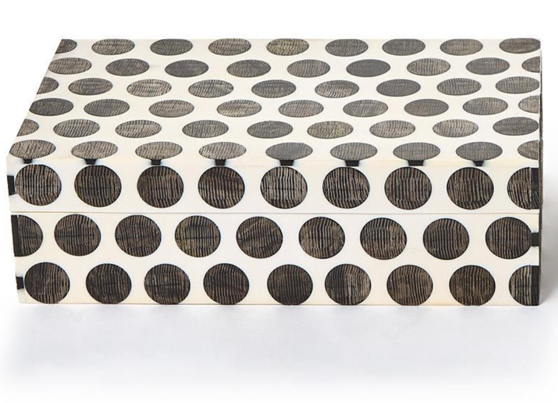 The Dot Chiseled Covered Box by Two's Company features a rectangular white design with large, evenly spaced black dots. Closed and stylish, it resembles handcrafted decorative boxes and sits elegantly on a white surface.