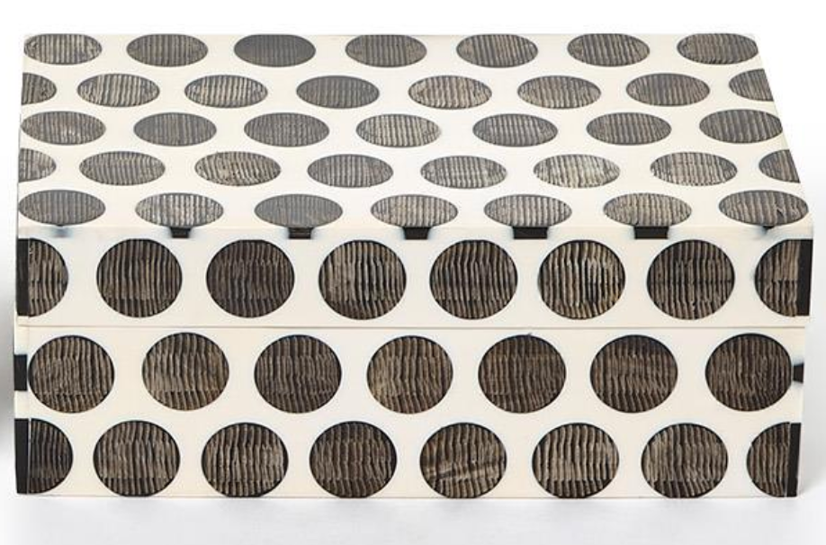 The Two's Company Dot Chiseled Covered Box features a white rectangular design with bold black dots, offering a stylish, handcrafted accent for decorative storage or unique resin decor.