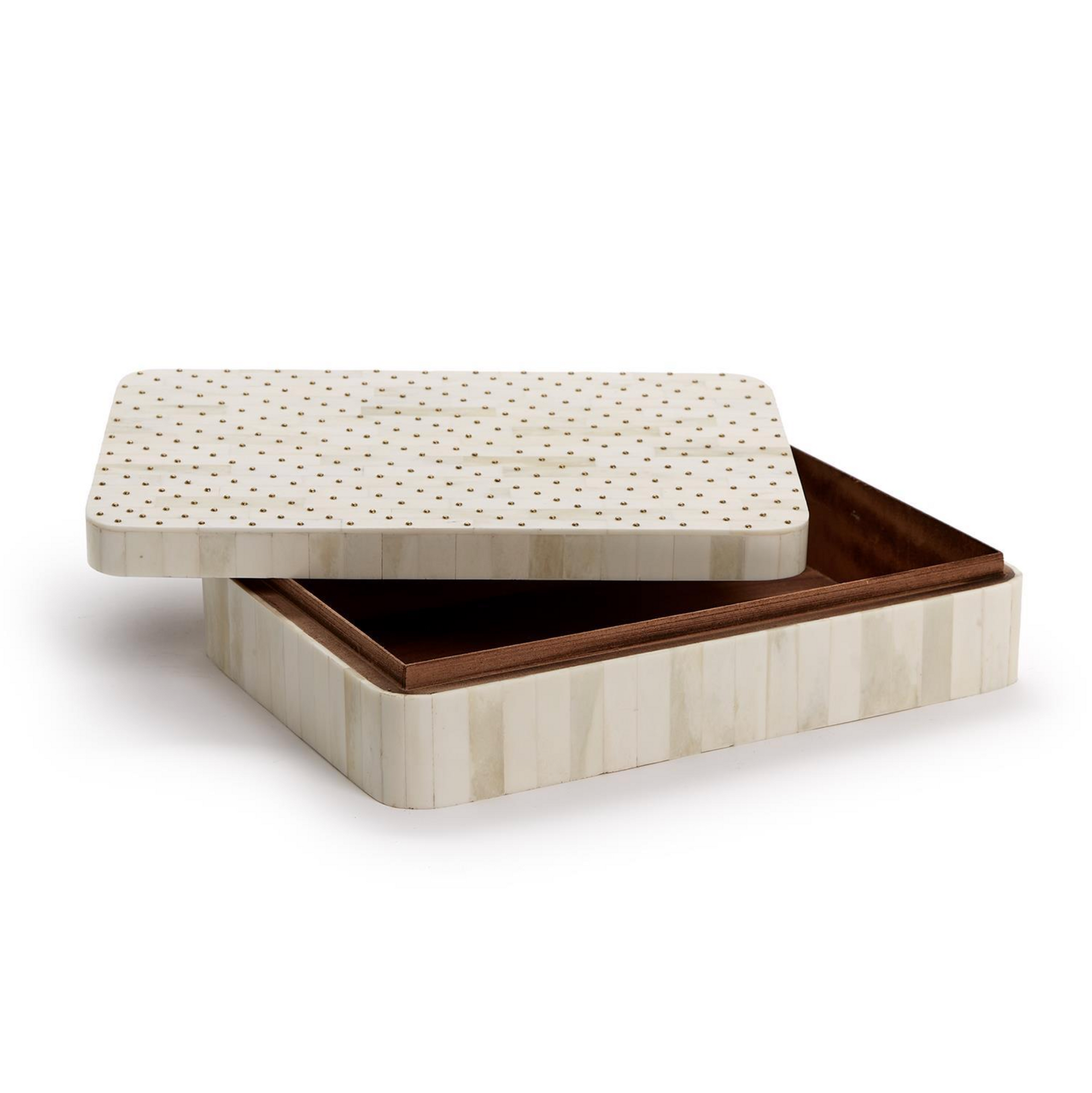 The Studded Covered Box by Two's Company is a rectangular, handmade piece from the Treviso collection, with a cream exterior featuring vertical stripes and gold dots. Its hinged lid is partially open, revealing a brown-lined interior.
