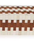 The JigSaw Covered Box by Two's Company is a rectangular handmade decorative box featuring a checkered white and brown tile design, ideal for adding charm to wood interiors. All visible surfaces are adorned for a striking look.