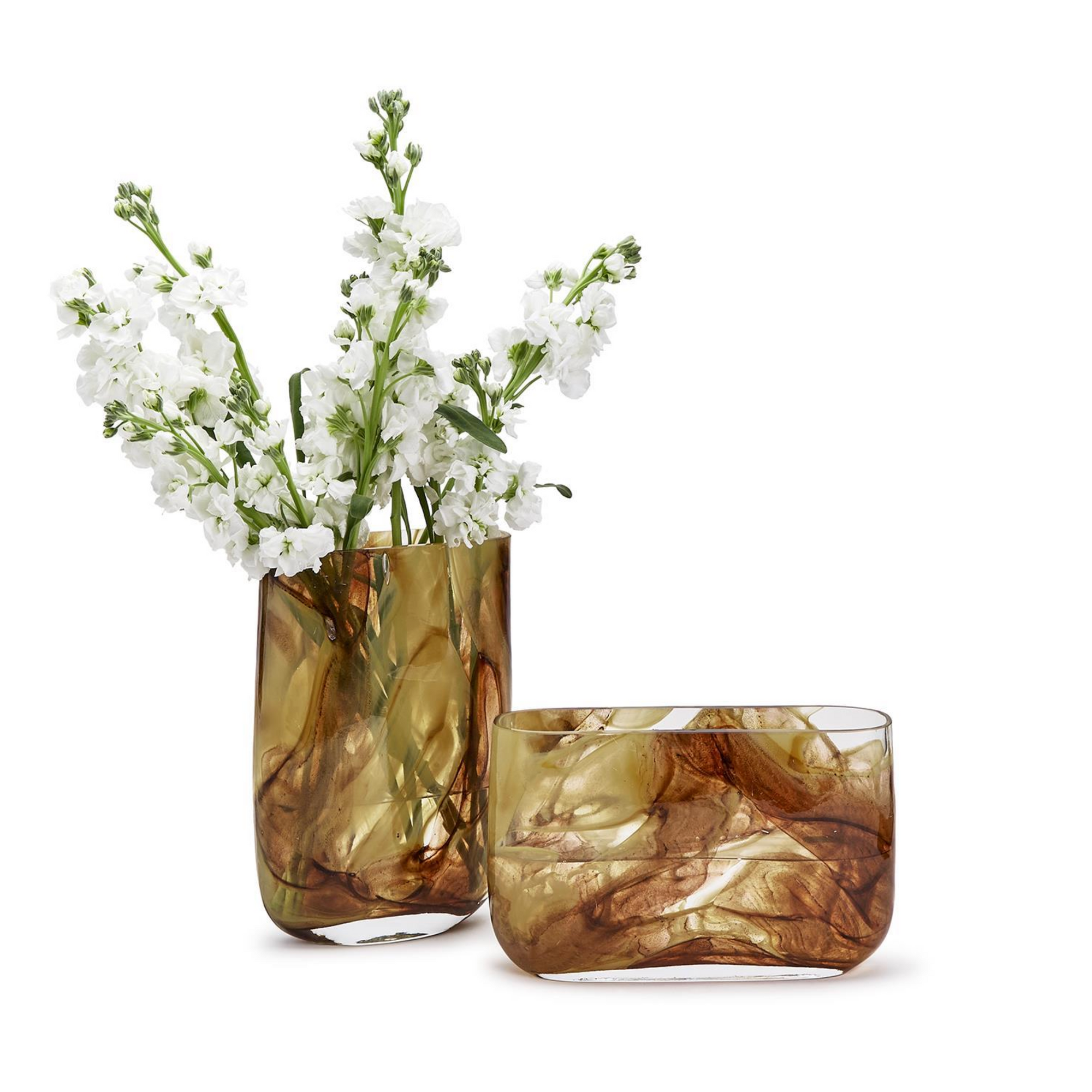 Two Swirl Blown Glass Vases by Two's Company, one tall holding white flowers and one short and empty, both with brown marbled designs, are displayed on a white background—artful home decor accents.