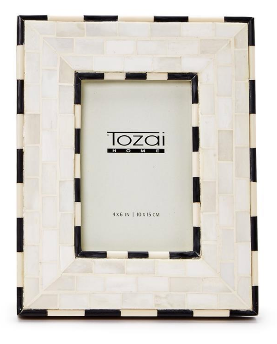 The Brick Pattern Photo Frame by Two's Company is a rectangular handmade frame featuring a mosaic checkerboard border with alternating white and black tiles and a 4x6 inch (10x15 cm) display area.