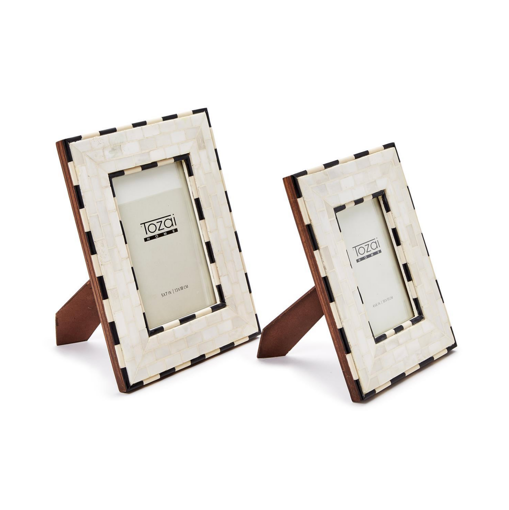 Two Brick Pattern Photo Frames by Two's Company feature an ivory and black checkerboard border and stand upright on brown easel backs, elegantly displaying your photos.