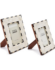 Two Brick Pattern Photo Frames by Two's Company feature an ivory and black checkerboard border and stand upright on brown easel backs, elegantly displaying your photos.
