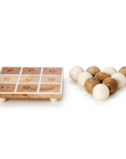 The Tic Tac Toe Game by Two's Company is handcrafted from mango wood, featuring nine recessed squares and round cream and light wood pieces—ideal for adding stylish decor to your game room.
