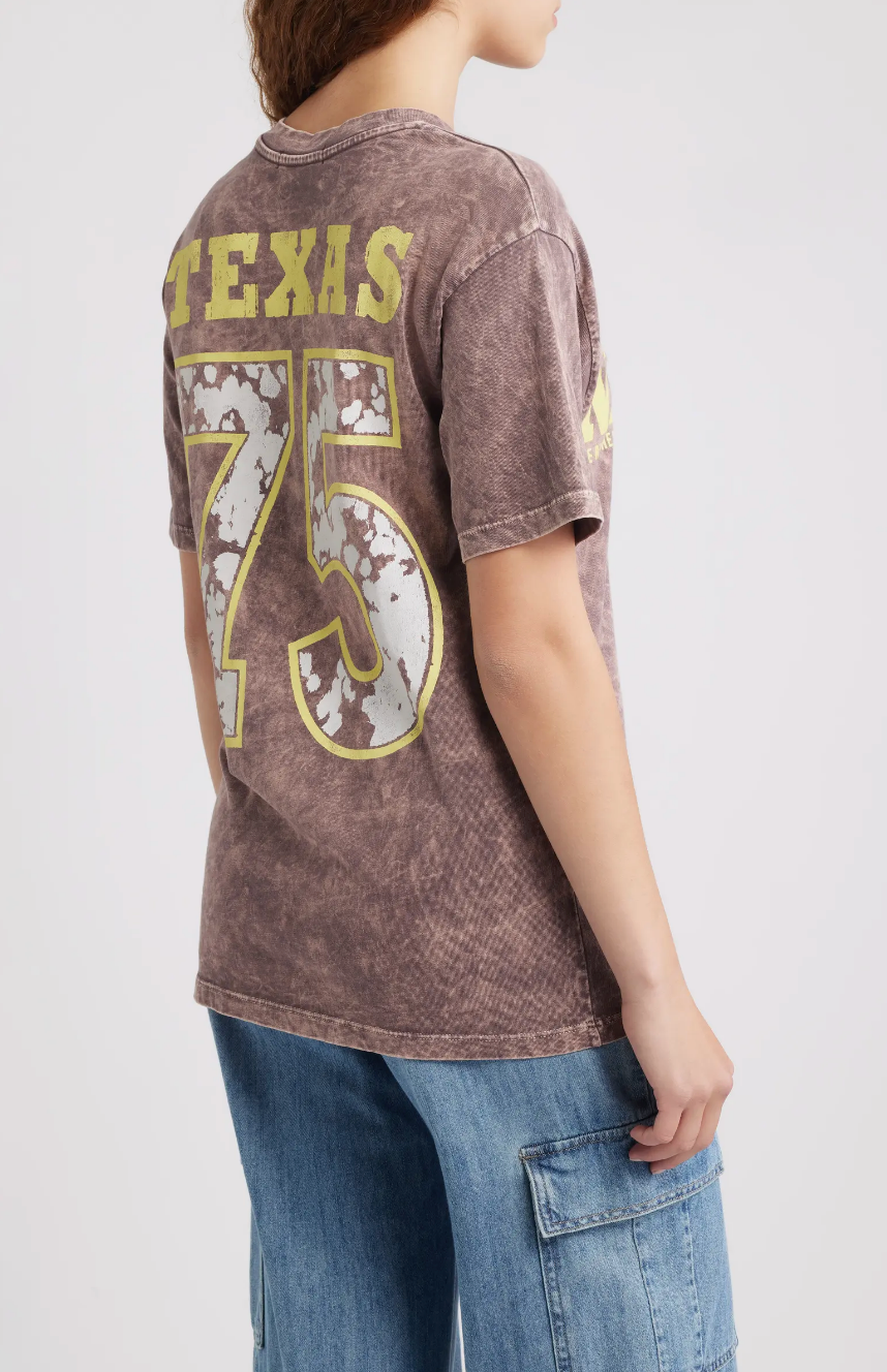 A person wearing the DayDreamer Willie Nelson Red Headed Stranger Tee.