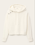 The BA&SH Sweatshirt Didi is a white, long-sleeve hooded sweatshirt with drawstrings and three silver brooches on the left shoulder near the hood, made from soft, easy-care polyester cotton.