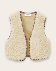 The BA&SH Jacket Celton is a sleeveless, cream faux shearling vest with fluffy texture and patterned edge trim, made from washable polyester and shown against a plain light background.