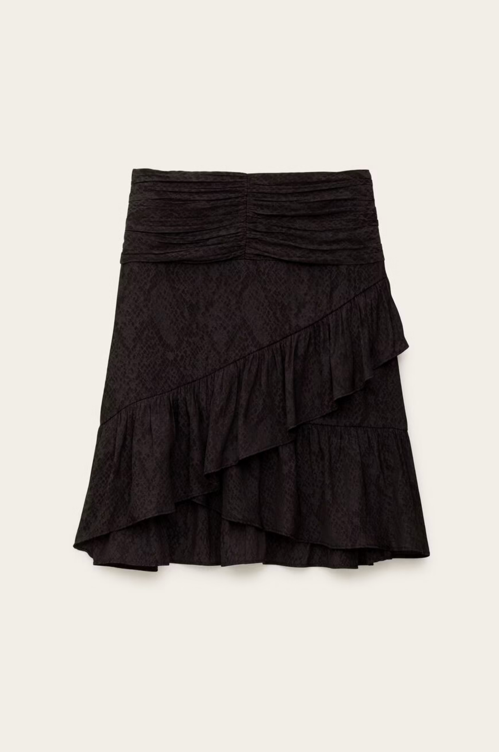 The Skirt Rino by BA&SH is a black, knee-length polyester skirt with a ruched waistband and diagonal layered ruffles across the front and hem, shown against a plain light background.