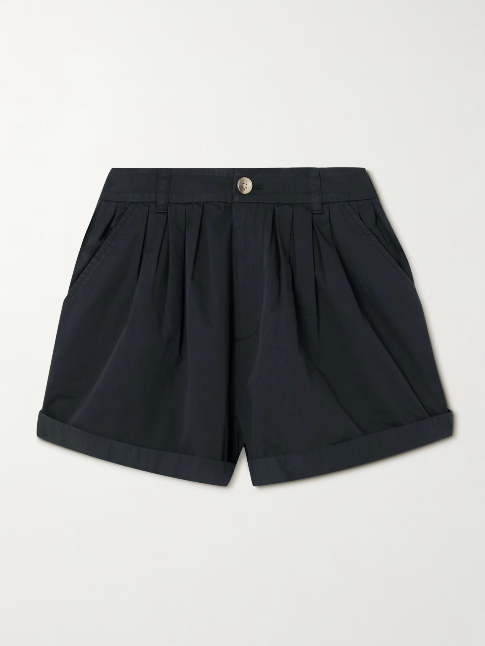 The Paige Short by DOEN is a pair of dark navy blue tailored shorts featuring a button and zip closure, front pleats, side pockets, and rolled-up cuffs, shown against a plain light background.