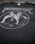 The Made Worn Fleetwood Mac Tee is a vintage unisex black shirt made in the USA, featuring two penguins in top hats, "Fleetwood Mac" above, and "U.S. Tour '77" below.