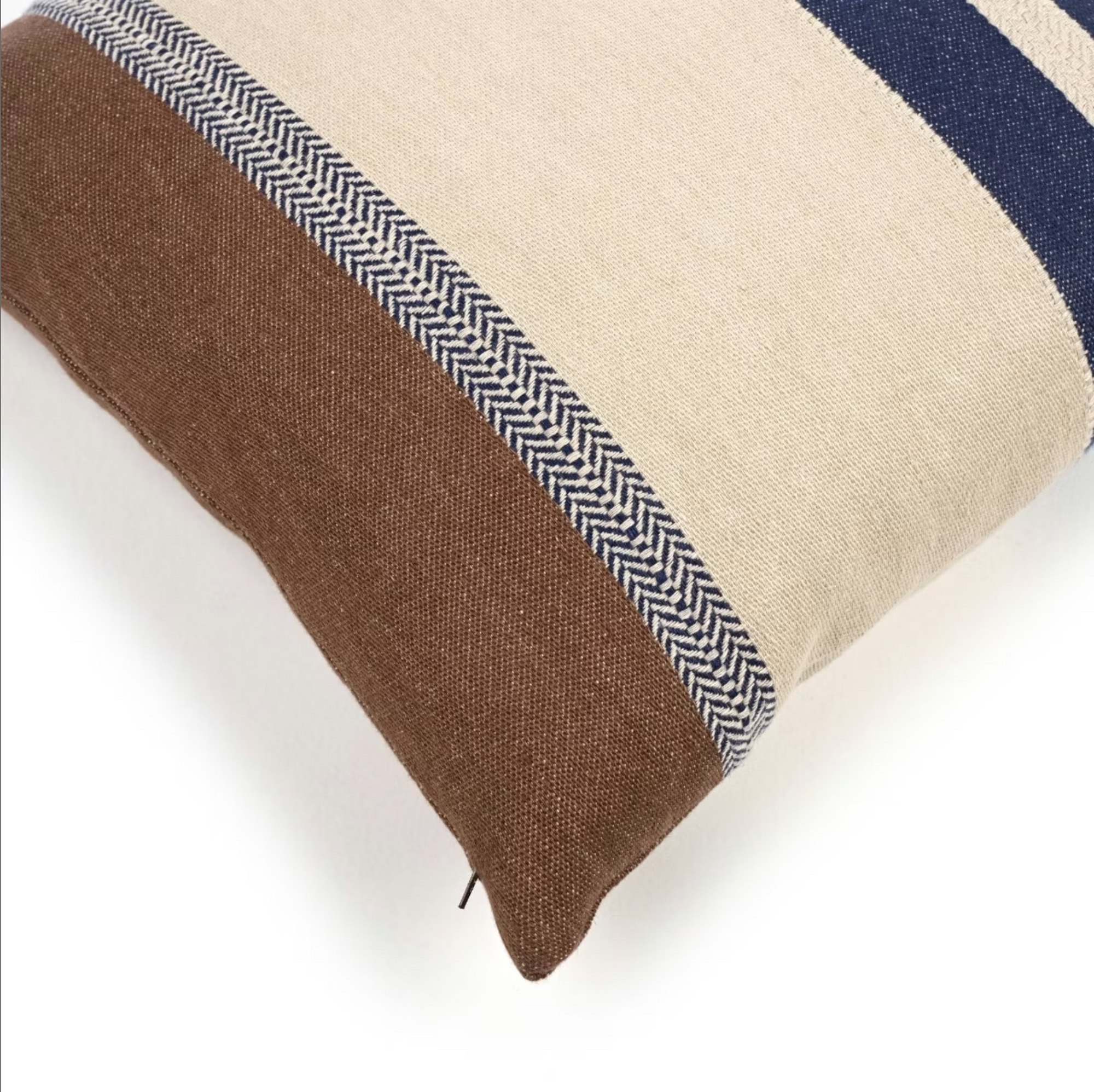 The Libeco Home Marina Stripe Pillow 20x20 features brown, cream, and navy horizontal stripes—including a herringbone design—and comes with a plush insert for comfort. Perfect for adding style to any white surface.