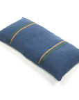 The Max Pillow by Libeco Home is a rectangular blue 25x25 lumbar pillow featuring two sets of green and tan diagonal parallel stripes, shown on a white background.