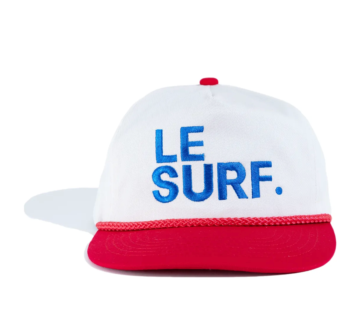 The Le Surf Vintage Lesure Icon Cap by Ping Pong Surf Club features a white crown, red brim and trim, plus bold blue "LE SURF." embroidery on the front for classic coastal style.