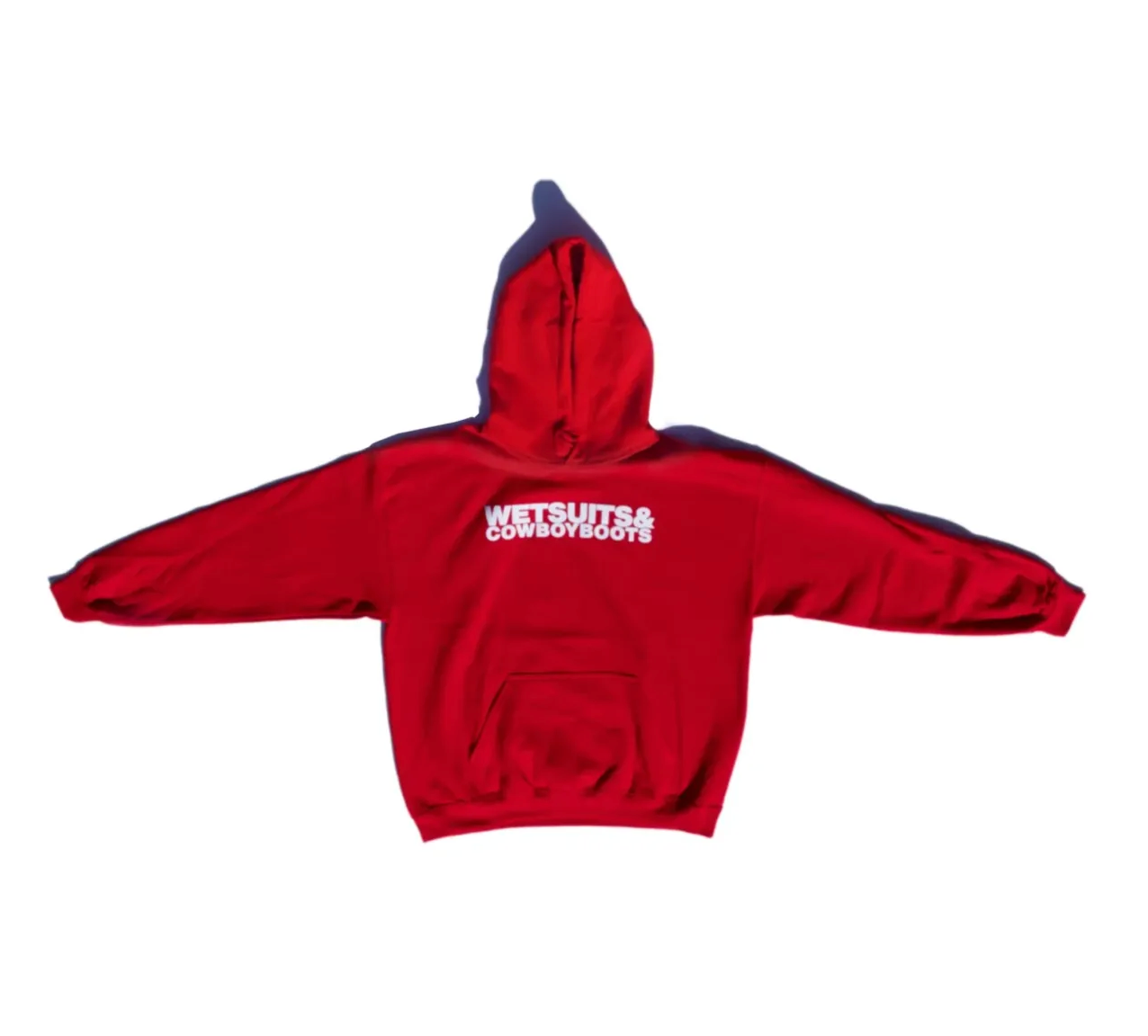 The Ping Pong Surf Club Wet Suit &amp; Cowboy Boots Hoodie is a bright red cotton-poly blend sweatshirt with “WETSUITS &amp; COWBOYBOOTS” in bold white on the back, shown against a plain white background.