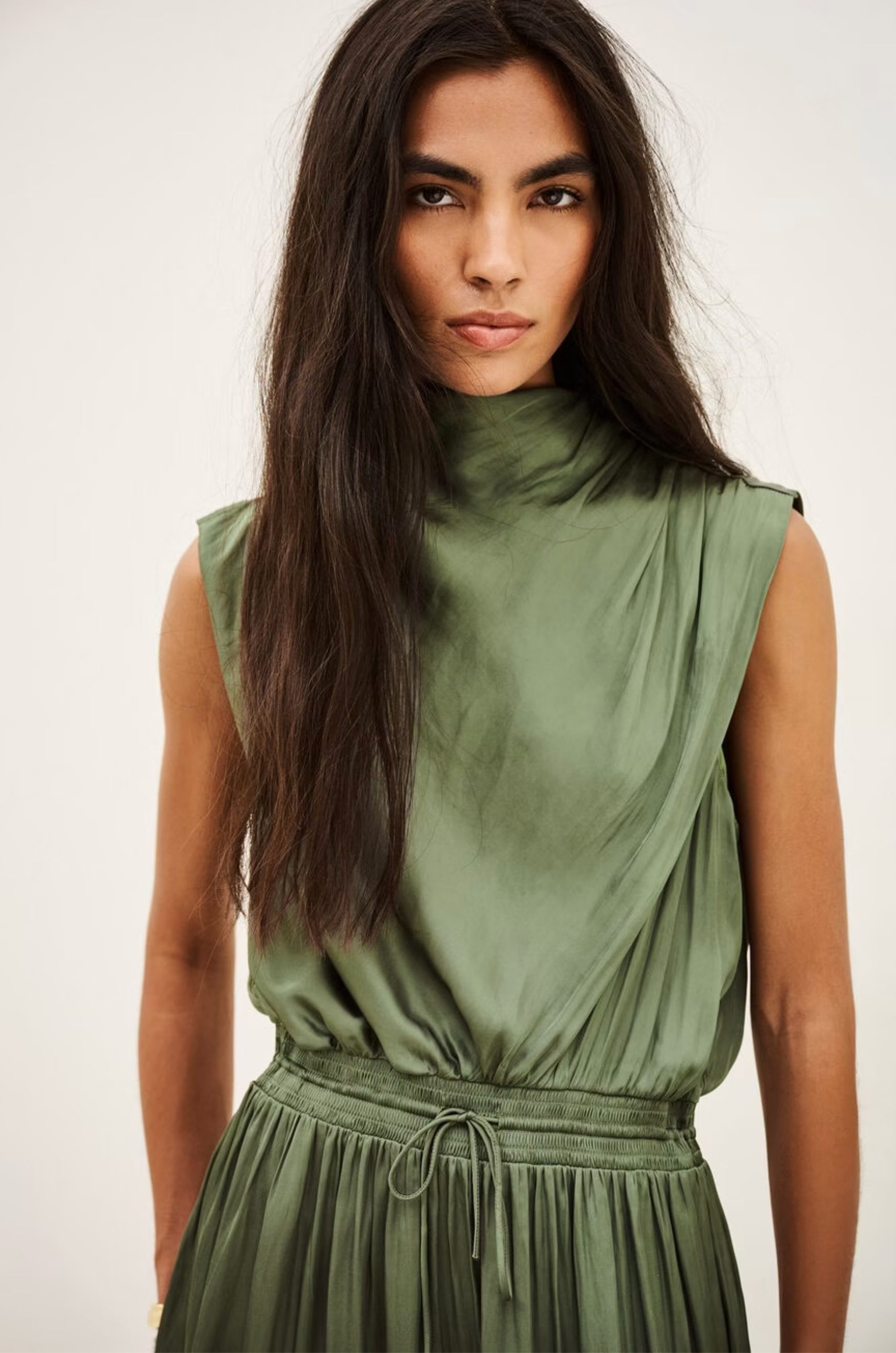 BA&amp;SH Celea sleeveless olive green satin midi dress modeled with confidence, showcased for Bungalow Furniture &amp; Accessories.