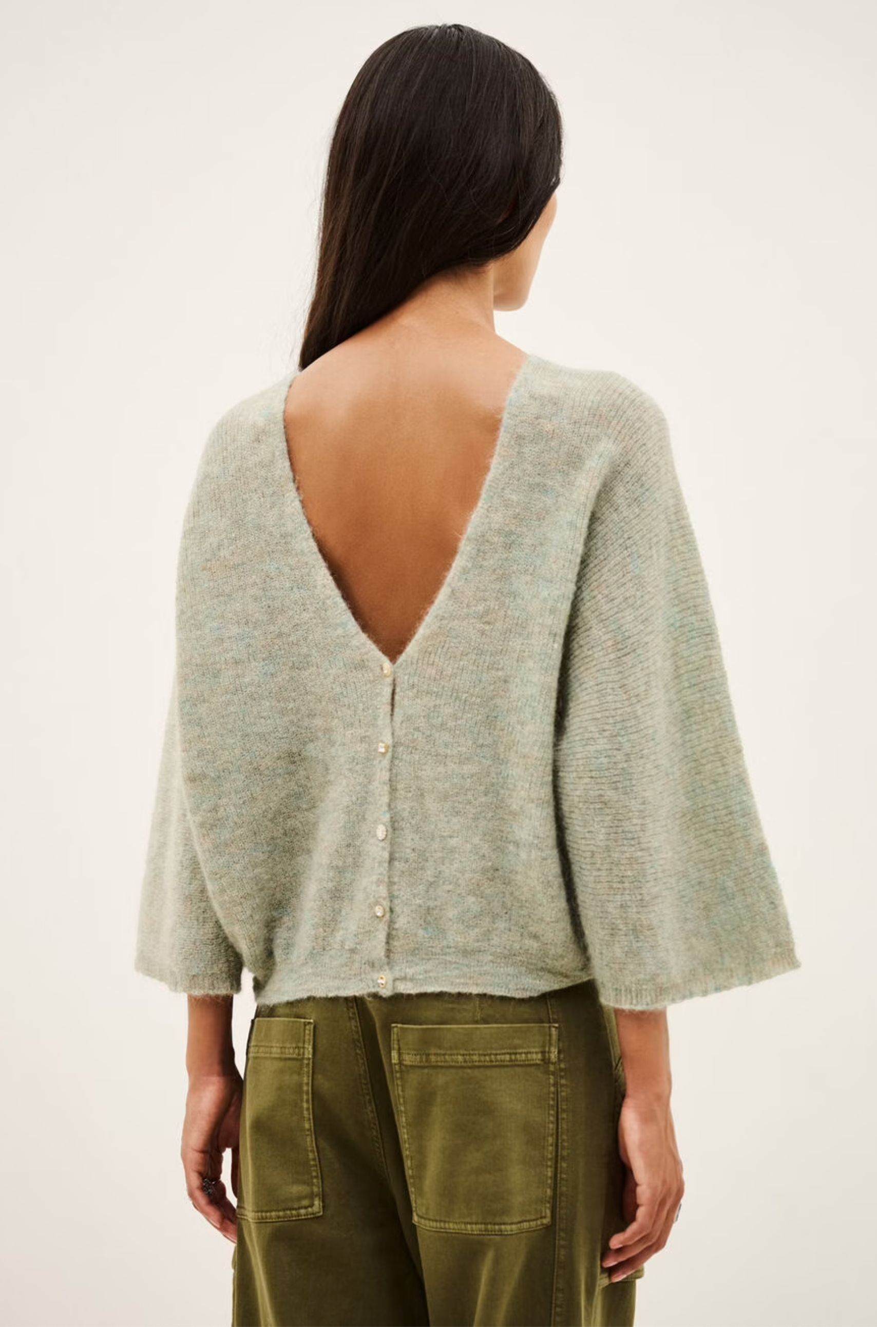 Light gray mohair-alpaca V-neck cardigan with deep V-back by BA&amp;SH, styled with olive pants.