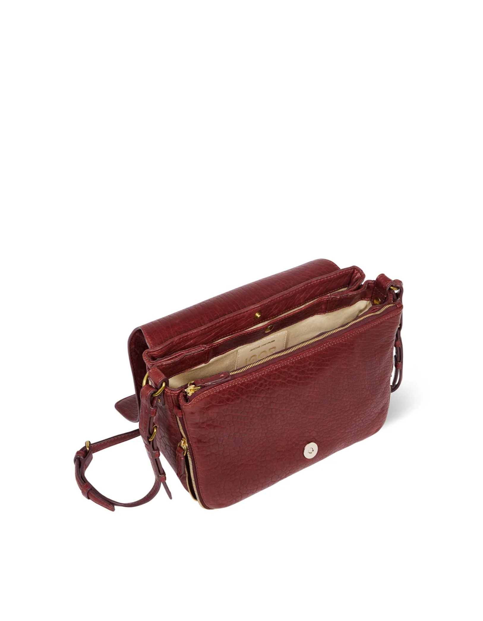 Burgundy lambskin bag with flap, beige interior, compartments, and adjustable strap by Jerome Dreyfuss.