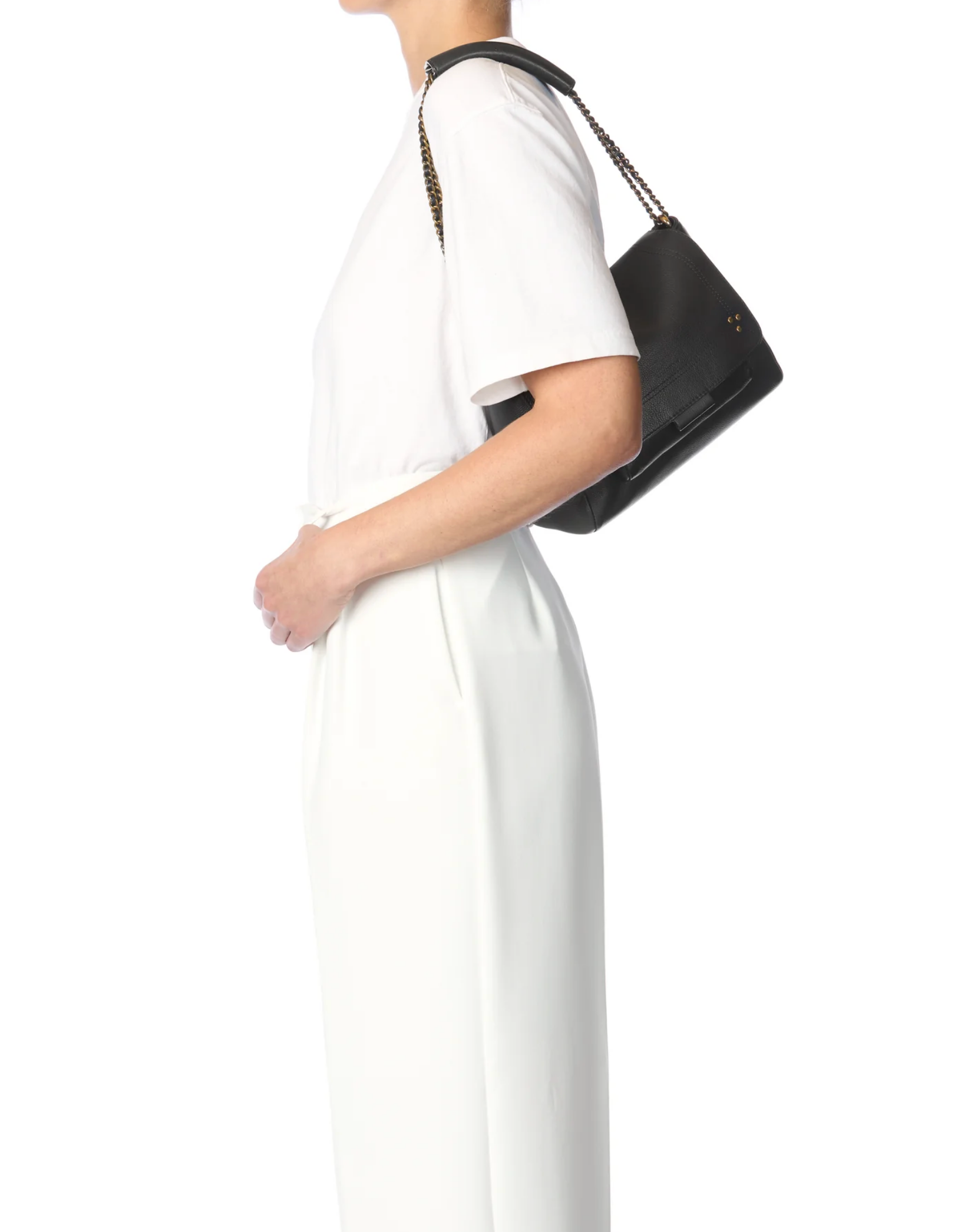 Jerome Dreyfuss Lulu M Bag with leather and chain strap, worn by a woman in white for an elegant, modern look.