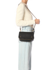 Jerome Dreyfuss Bobi small goatskin bag with adjustable chain strap styled with a white sweater and jeans.