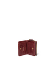 Compact maroon goat leather wallet with gold zipper, card slots, and coin compartment by Jerome Dreyfuss.