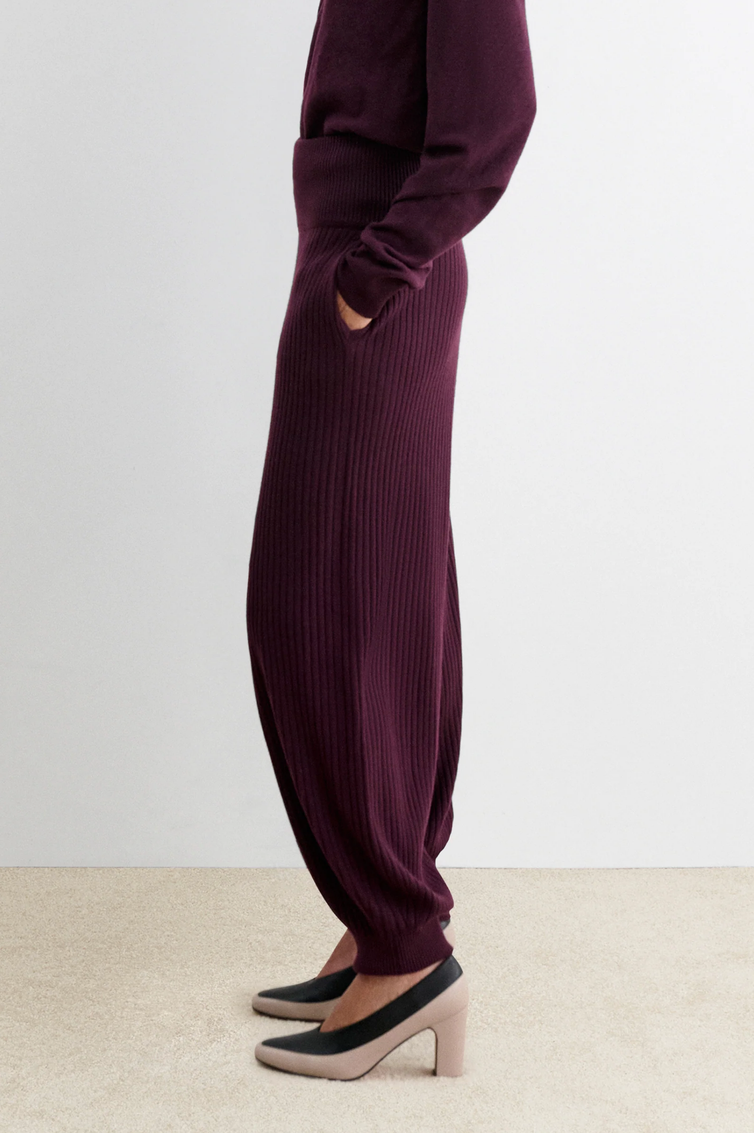 Rachel Comey Nim Pant and matching top in beige, styled with heels on neutral carpet by a white wall.