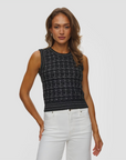 Gia Tweed noir knit sleeveless top by KUJTEN paired with white pants, styled in a minimal studio setting.