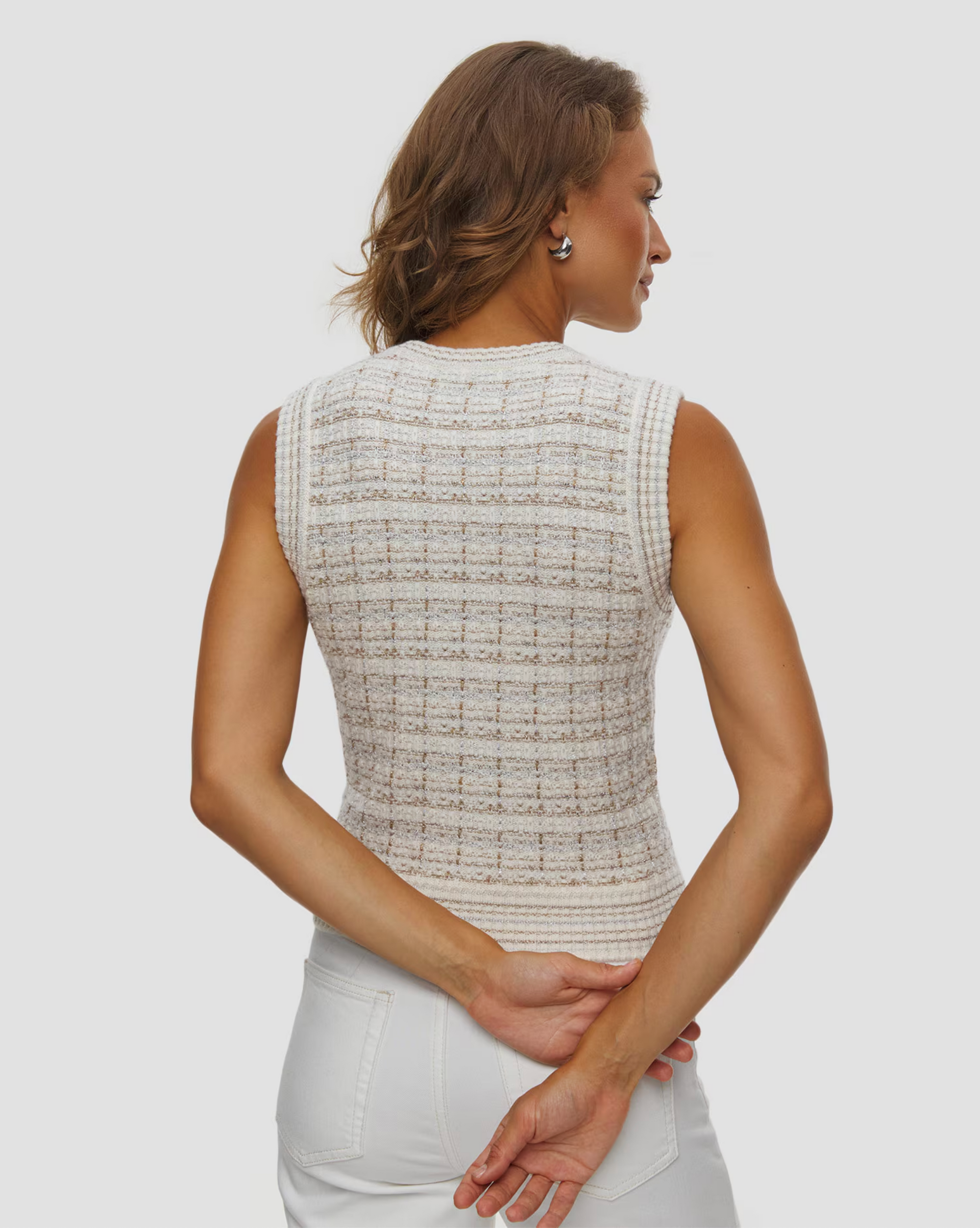 KUJTEN Gia Tweed sleeveless top in white, shown from the back, paired with white pants in a minimal setting.