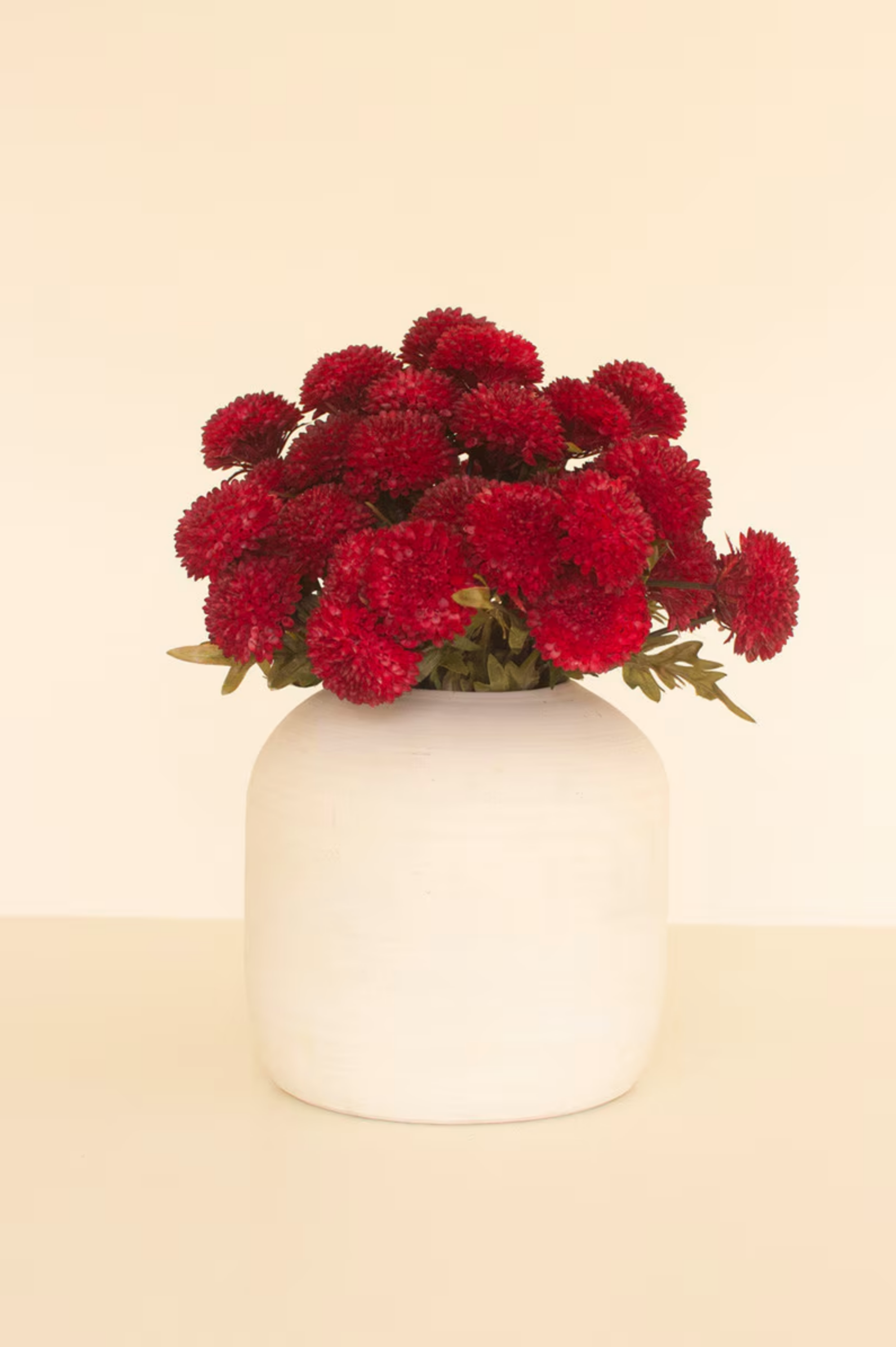 Red Dahlia vase with vibrant blooms by Kalalou, Inc. on a beige background, available at Bungalow Furniture &amp; Accessories.