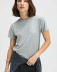 Heather grey relaxed-fit tee in organic cotton by Sold Out NYC, worn by woman with a brown bob hairstyle.