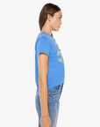 Side profile of a woman wearing The Boxy Goodie Goodie On The Road Again blue t-shirt with text and blue jeans, standing against a white background.
