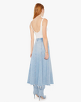 The woman is wearing The Full Swing I'm With The Band tank top with a long blue denim skirt with frayed edges, paired with blue high-heeled shoes styled for an Arizona look. She is standing on a plain white background.