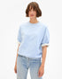 Clare Vivier SS Oversized Sweatshirt in Heather Blue, styled with faded jeans against a white backdrop.