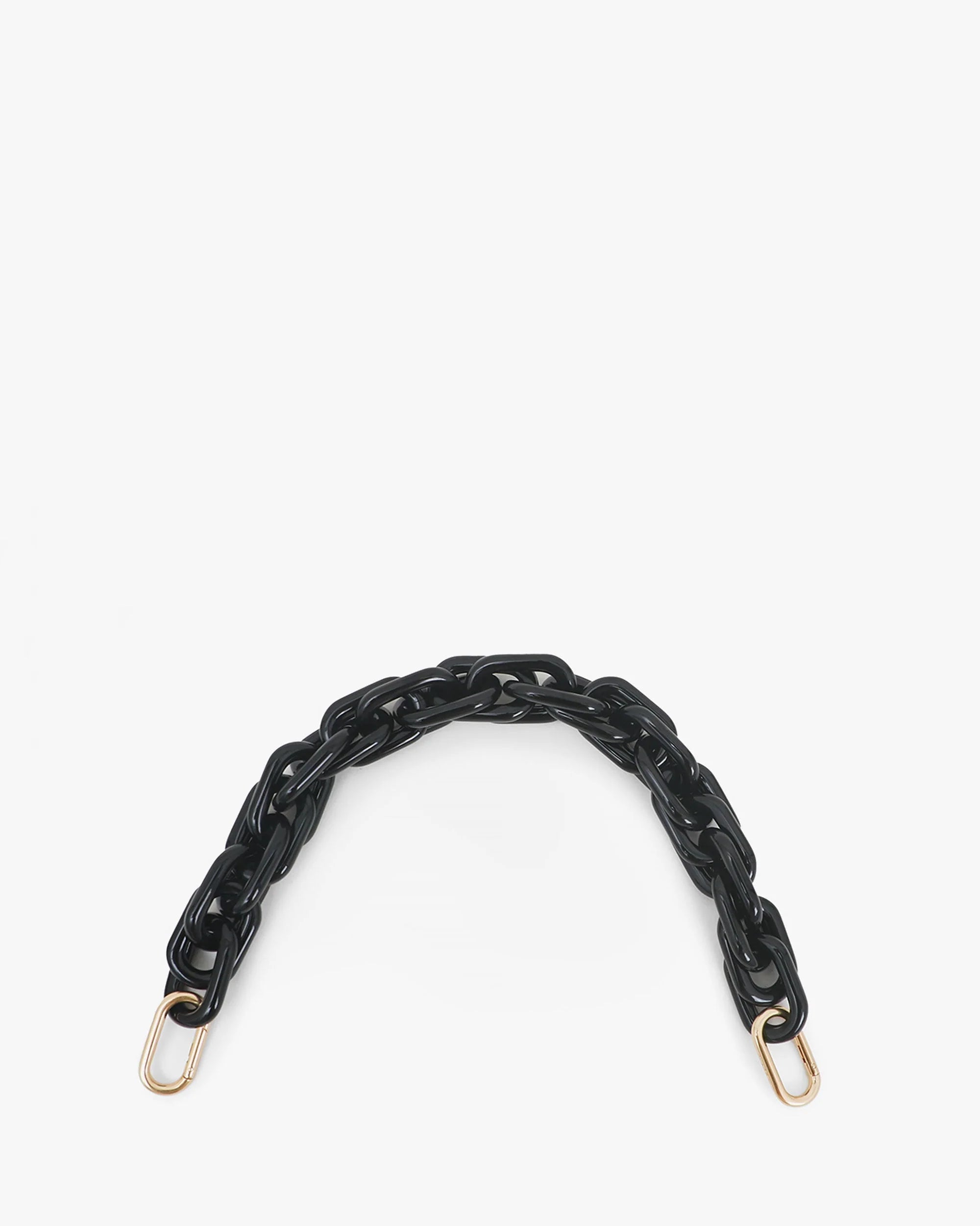 The Clare Vivier Shortie Strap S24 is a black resin chain strap with gold-tone brass spring links and D-rings at both ends, shown against a plain white background.