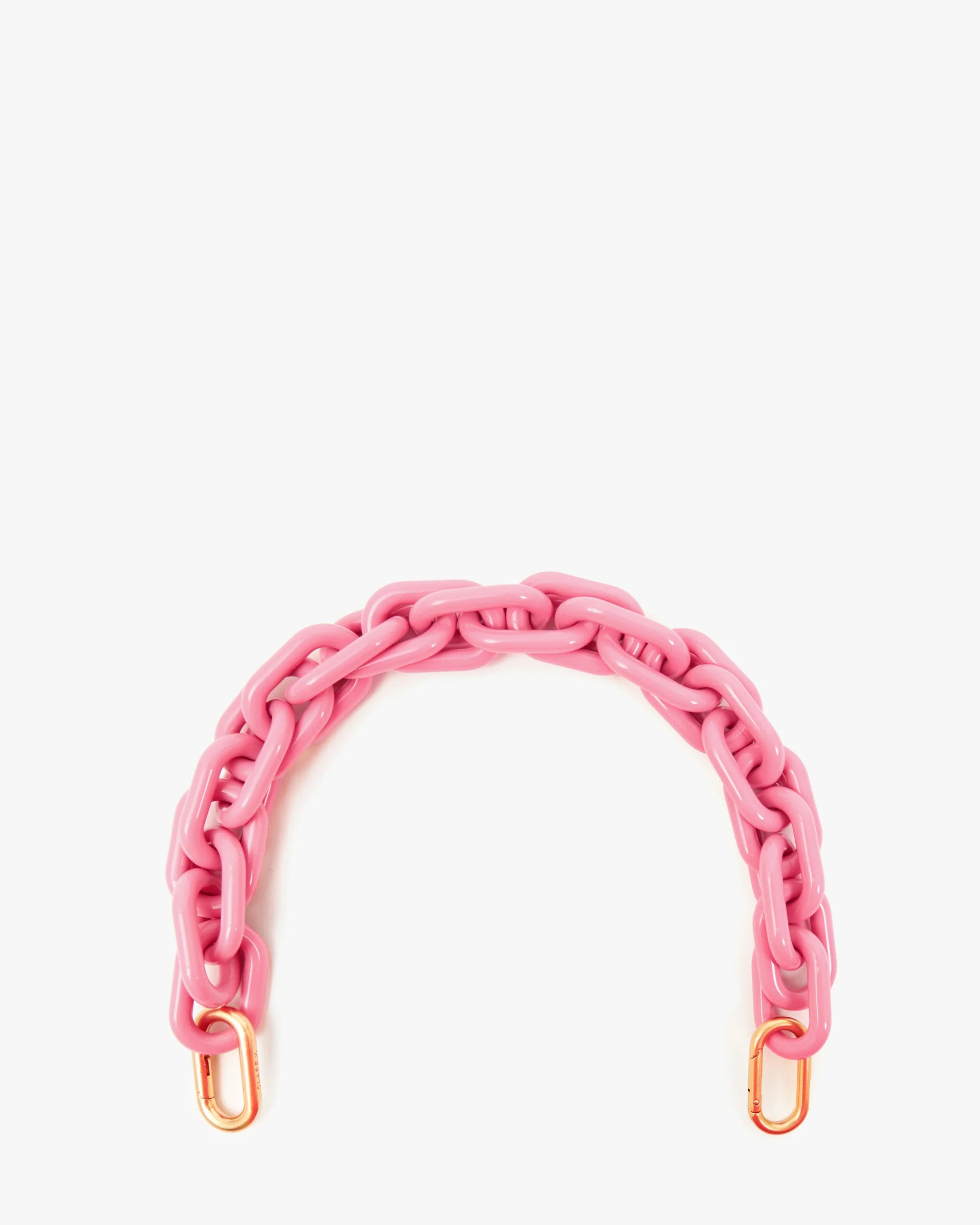 The Clare Vivier Shortie Strap Q1 is a chunky pink plastic bag handle with gold-tone clasps at each end, evoking a vintage chain style and shown on a white background.